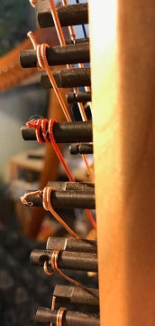 Bass CPB wire strings. Also note that these do not cross themselves on the pins, which could damage the outer wire wrapping.